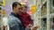 Footage father and son buys baby food in supermarket