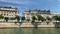 Footage of historical, traditional and typical buildings by Seine river. It is a sunny summer day.
