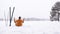 Footage of a male skier sitting on the snowy landscape. Relaxing and Enjoying