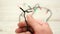 Footage of man's hands trying to untangle unravel christmas lights isolated on white background