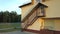 Footage of modern daycare school building with emergency fire exit staircase.