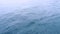 Footage movement of ocean surface, abstract blue green color pattern slow motion. daylight sparkling reflected on the water