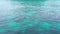 Footage movement of ocean surface, abstract blue green color pattern slow motion. daylight sparkling reflected on the water