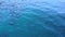 Footage movement of ocean surface, abstract blue green color pattern slow motion. daylight sparkling reflected on the water