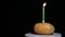 Footage of potato candle dark background