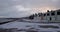 Footage of a scottish seaside village promenade under some snow early in the morning