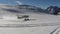 Footage of small private airplane landing on glacier in mountains