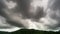 Footage Timelapse Dark sky and black cloud. Black clouds moving fast in Dramatic sky over mountains.Dark stormy raining cloudy nat