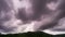 Footage Timelapse Dark sky and black cloud. Black clouds moving fast in Dramatic sky over mountains.Dark stormy raining cloudy nat