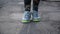 Footage woman jumping on a skipping rope in a park close-up