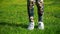 Footage woman jumping on a skipping rope in a park close-up