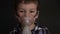 Footage young boy inhaling through inhaler mask