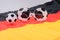 Football and abstract glasses on the german flag