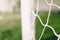 Football background. Soccer football equipment. White soccer net on a goal