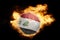 Football ball with the flag of iraq on fire
