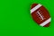 Football ball isolated on green background for American football game background