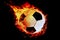 A football ball wrapped in fire flies on a black background!