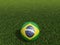 Football in Brazil flag  on  green grass. 3d