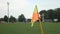 Football corner flag waving in wind on soccer field. Corner flag on football pitch. Soccer match. Sport concept