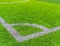 Football Corner line on green artifact grass of soccer indoor pitch