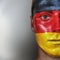 Football fan with German flag painted on his face