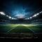 Football field bathed in the glow of powerful stadium spotlights