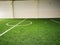 Football field - Futsal field green grass sport indoor white line center.