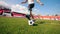 Football field and a male paralympian dribbling the ball