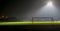 Football field at night and with spotlight