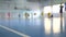 Football futsal training for children. Indoor soccer young player with a soccer ball in a sports hall.