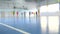 Football futsal training for children. Indoor soccer young player with a soccer ball in a sports hall.