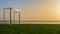 Football gate on the sea shore against