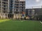 Football gates to the sports ground in the city yard on the background of a new residential building