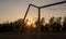 Football goal with sunset light background in the public stadium