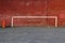 Football Goalposts, North London, England, UK - 20 March 2018 : Painted Goalpost Graffiti on Redbrick Wall with Orange Traffic Con