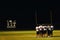 Football huddle at night game