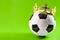 Football is the king of sports, championship winner and league champion concept with a soccer ball wearing a golden crown isolated