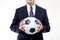 Football manager hold ball with his hands