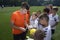 Football player Aleksandr Pikhalyonok, Shakhtar soccer team, signing autographs to children