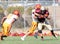 Football Player Being Tackled During a Game