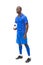 Football player in blue standing and holding ball