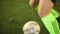 Football player (forward) tricks with a ball in soccer match