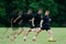 Football player kicking a ball in multiple exposures