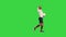 Football player running in front of the stands after he scored on a Green Screen, Chroma Key.