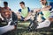 Football player, stretching and feet of men training on a field for sports game and fitness. Closeup on shoes of male