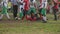 Football player tackled by strong rivals, sportsman suffers injury during match