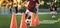 Football Player on Training Slalom Drill With Ball