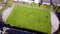 Football players running around the football field. Top view of the football youth tournament