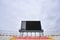 Football scoreboard and empty tribune