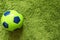 Football Soccer ball on a green surface imitating artificial grass. Sports photography